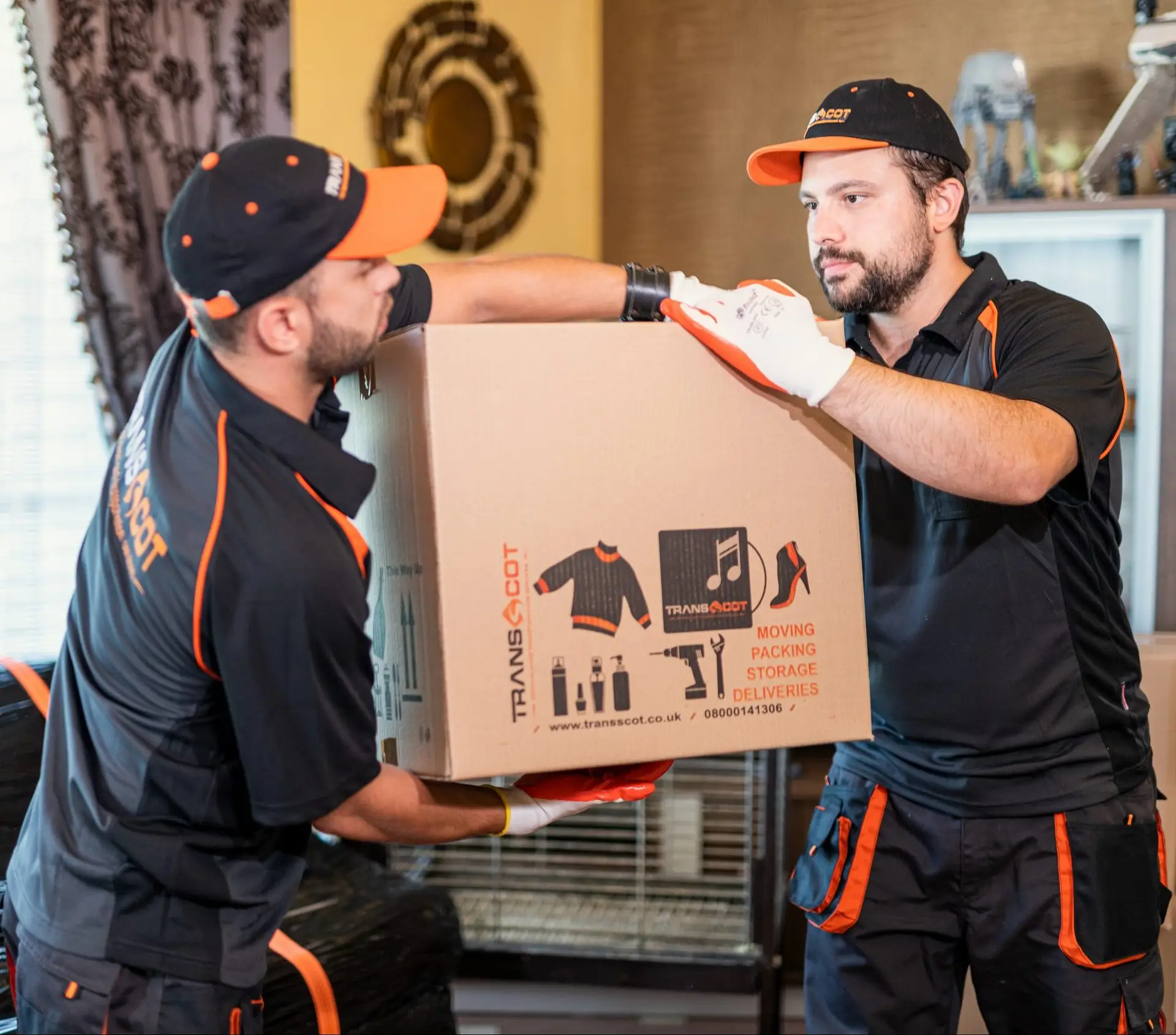 TransScot Removals team carrying boxes during a house move in Motherwell